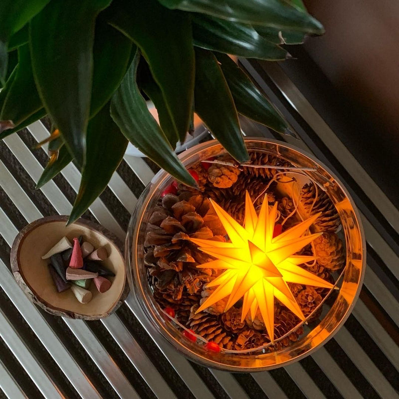 European Ware Haus Herrnhuter Stars Canada - Small Yellow Star displayed in Glass Jar with pine cones