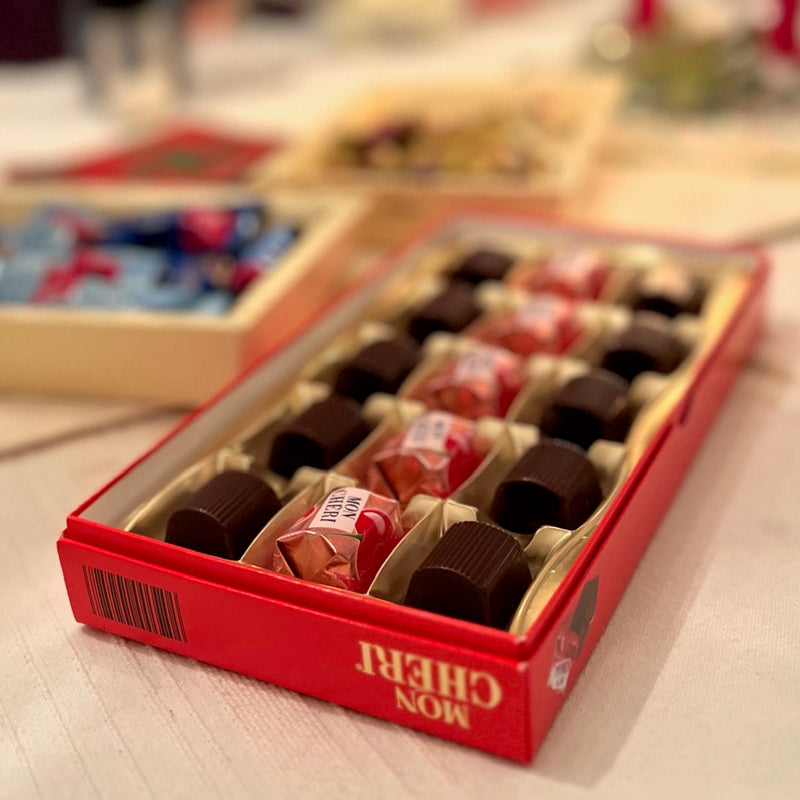 Ferrero Mon Chéri dark chocolate pralines filled with whole cherries and cherry liqueur, 15-piece gift box.